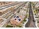 Aerial view shows rooftops, a street, and a glimpse of a backyard with artificial turf of neighborhood homes at 7948 Eastern Elk St, Las Vegas, NV 89149