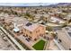 Aerial shot showing a home's backyard with turf and patio furniture, in a neighborhood setting with mountain views at 7948 Eastern Elk St, Las Vegas, NV 89149