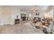 Bright living room with tile flooring, ceiling fan, media center, and comfortable seating arrangement at 7948 Eastern Elk St, Las Vegas, NV 89149