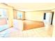Bright living room featuring tile entry, wood floors, neutral paint, and sliding door to a patio at 8101 W Flamingo Rd # 1044, Las Vegas, NV 89147