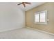 Bedroom with vaulted ceiling, ceiling fan, and a window with plantation shutters at 8204 Turbys Treehouse Pl, Las Vegas, NV 89131