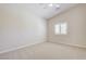 Spacious bedroom featuring neutral carpet and a window with plantation shutters at 8204 Turbys Treehouse Pl, Las Vegas, NV 89131