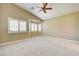 Spacious bedroom with vaulted ceilings, bay window and shuttered windows, and neutral carpeting at 8204 Turbys Treehouse Pl, Las Vegas, NV 89131