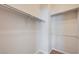 Spacious walk-in closet has shelves and racks to store clothing at 8204 Turbys Treehouse Pl, Las Vegas, NV 89131
