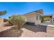 Exterior view of the house featuring a covered patio and side yard at 8204 Turbys Treehouse Pl, Las Vegas, NV 89131