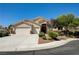 Inviting single-story home with a well-maintained yard and a convenient three-car garage at 8204 Turbys Treehouse Pl, Las Vegas, NV 89131