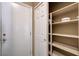 Hallway view of a linen closet and an exterior door at 8204 Turbys Treehouse Pl, Las Vegas, NV 89131