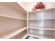 Walk-in pantry featuring built in shelving for optimal storage capacity and organization in the home at 8204 Turbys Treehouse Pl, Las Vegas, NV 89131