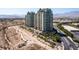 Expansive view of the luxury condo building set against a desert landscape and mountain backdrop at 9101 Alta Dr # 301, Las Vegas, NV 89145