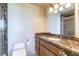 Bathroom features a marble countertop, updated vanity, toilet, and enclosed walk-in shower at 9101 Alta Dr # 301, Las Vegas, NV 89145