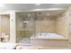 Elegant bathroom featuring a walk-in glass shower and separate soaking tub at 9101 Alta Dr # 301, Las Vegas, NV 89145