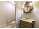 Bathroom features a unique vanity, toilet, and decorative mirror at 9101 Alta Dr # 301, Las Vegas, NV 89145