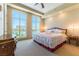 Bright bedroom with large windows offering city views and a well decorated bed at 9101 Alta Dr # 301, Las Vegas, NV 89145