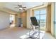 Bedroom features carpet, ceiling fan, large window, and view of the city at 9101 Alta Dr # 301, Las Vegas, NV 89145