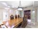 Formal dining room with seating for eight, featuring a decorative chandelier and a built-in wine cellar at 9101 Alta Dr # 301, Las Vegas, NV 89145