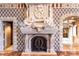 An ornate fireplace features marble surround and statues of reclining figures above the opening at 9101 Alta Dr # 301, Las Vegas, NV 89145