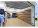 Spacious garage with epoxied floor and storage racks is perfect for multiple cars and storage solutions at 9101 Alta Dr # 301, Las Vegas, NV 89145