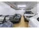 Garage with epoxy floors, bright lighting, and room for multiple vehicles at 9101 Alta Dr # 301, Las Vegas, NV 89145