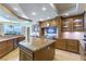 Gourmet kitchen featuring custom cabinetry, granite countertops, and stainless steel appliances at 9101 Alta Dr # 301, Las Vegas, NV 89145