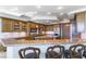 Gourmet kitchen with a granite island, stainless appliances and breakfast bar seating at 9101 Alta Dr # 301, Las Vegas, NV 89145