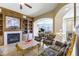 Luxurious living room with fireplace and open layout with marble floors at 9101 Alta Dr # 301, Las Vegas, NV 89145