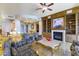 Opulent living room features a fireplace, built-ins, and marble floors, creating a cozy, luxurious atmosphere at 9101 Alta Dr # 301, Las Vegas, NV 89145