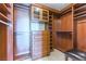 This spacious walk-in closet has custom wood shelving, drawers, and a cushioned seat at 9101 Alta Dr # 301, Las Vegas, NV 89145