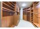 Custom walk-in closet with extensive shelving, hanging space, and built-in drawers at 9101 Alta Dr # 301, Las Vegas, NV 89145