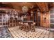 A tasting room is surrounded by wood paneled cabinets for wine storage and counter for serving at 9101 Alta Dr # 301, Las Vegas, NV 89145