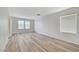 Spacious bedroom featuring hardwood floors and two windows allowing ample natural light at 9507 Brewing Cloud Ave, Las Vegas, NV 89148