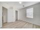 This bedroom features wood-look floors and a large window at 9507 Brewing Cloud Ave, Las Vegas, NV 89148