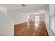 Spacious living room with hardwood floors, and a sliding glass door offering great light at 9507 Brewing Cloud Ave, Las Vegas, NV 89148