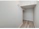 Walk-in closet features wood look floors and wire rack shelves at 9507 Brewing Cloud Ave, Las Vegas, NV 89148