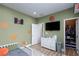 Childs bedroom with basketball theme has wood-look floors and a walk-in closet for ample storage at 10095 Ferton Lake Ave, Las Vegas, NV 89178