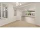 Bright living room area with trey ceilings and a window overlooking the yard at 10463 Luna Magico Ave, Las Vegas, NV 89135