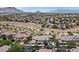 Aerial view of neighborhood with well-maintained streets and mountain view, showcasing community's location at 10640 Amber Ridge Dr # 101, Las Vegas, NV 89144