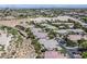 Extensive community aerial view showcasing the neighborhood's layout, landscaping, and nearby open spaces at 10640 Amber Ridge Dr # 101, Las Vegas, NV 89144