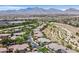 Expansive community aerial view with mountain backdrop showing layout, landscaping, and parking at 10640 Amber Ridge Dr # 101, Las Vegas, NV 89144