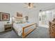 Comfortable bedroom featuring a ceiling fan, carpet flooring, and wall decor at 10640 Amber Ridge Dr # 101, Las Vegas, NV 89144