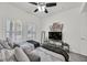 A bright bedroom with two beds, shuttered windows, and decor on the wall at 10640 Amber Ridge Dr # 101, Las Vegas, NV 89144