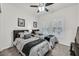 A bright bedroom with two beds, shuttered windows, and soft neutral decor at 10640 Amber Ridge Dr # 101, Las Vegas, NV 89144
