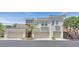 Beautiful home exterior featuring three garage spaces, neutral colors, and tasteful accents at 10640 Amber Ridge Dr # 101, Las Vegas, NV 89144