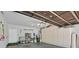 Spacious garage with ample storage cabinets, overhead lighting, and clean flooring at 10640 Amber Ridge Dr # 101, Las Vegas, NV 89144