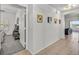A hallway with tiled floors leads to bedrooms, bathrooms, and the living room at 10640 Amber Ridge Dr # 101, Las Vegas, NV 89144
