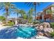 Inviting spa area featuring a waterfall, lush landscaping, and comfortable seating at 10640 Amber Ridge Dr # 101, Las Vegas, NV 89144