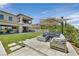 Inviting backyard with a modern fire pit, comfortable seating, and a well-maintained lawn at 1404 Reisling Ct, Las Vegas, NV 89144