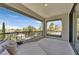 Inviting covered balcony with comfortable seating and an inspiring view of the surrounding neighborhood at 1404 Reisling Ct, Las Vegas, NV 89144