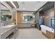 Luxurious bathroom with dual sinks, a soaking tub, and refined modern finishes at 1404 Reisling Ct, Las Vegas, NV 89144