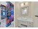 Modern bathroom with vibrant graffiti-style shower, sleek vanity, and contemporary fixtures for a unique design at 1404 Reisling Ct, Las Vegas, NV 89144