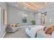 A modern bedroom with wood slat ceiling design, ample light, and stylish furnishings at 1404 Reisling Ct, Las Vegas, NV 89144